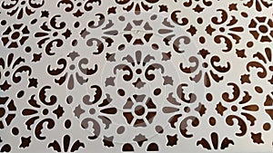 Abstract pattern on white plastic. Background. Texture. Abstract drawing for background and texture. Stencil for drawing