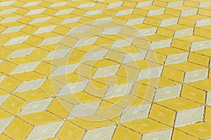 Abstract pattern yellow bright vibrant light pavement tile street road surface city texture background