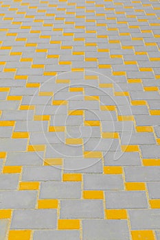 Abstract pattern yellow grey pavement tile street road surface city texture background paving urban structure