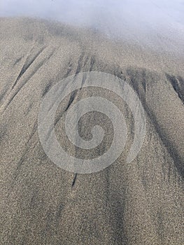 Abstract patterns in sand at Dalmore Bay, near Dun Carloway, Isle of Lewis, Scotland