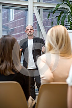 Abstract people lecture in seminar room, education or training concept