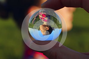 Abstract People. People, Travel Concept. Female Fingers Holding Crystal Ball Outdoors.