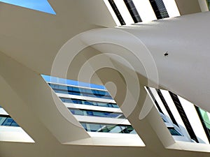 Abstract perspective of white color circular colum and flying open beams above