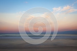 Long exposure photo at the beach at dusk with a beautiful, peaceful, dreamy scene