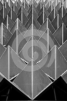 Abstract photo close-up view of modern aluminum ventilated facade of triangles