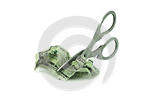 Abstract photo with iron scissors cutting crumpled counterfeit dollars isolated on white backgroun