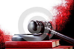 Abstract photo with wooden gavel and red book with codes isolated on white background as symbol of of rule of law with judge`s gav