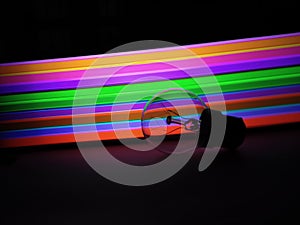 Abstract photograph of a bulb illuminated by bright background of colours