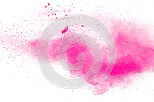 Abstract pink dust explosion on white background.  Freeze motion of pink powder splash