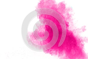 Abstract pink powder explosion on white background. Freeze motion of pink dust splattered