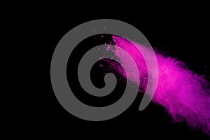 Abstract pink powder splatted background,Freeze motion of color powder exploding/throwing color powder,color glitter texture on bl