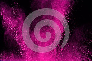 Abstract pink powder splatted background,Freeze motion of color powder exploding/throwing color powder,color glitter texture on bl