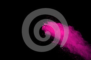 Abstract pink powder splatted background,Freeze motion of color powder exploding/throwing color powder,color glitter texture on bl