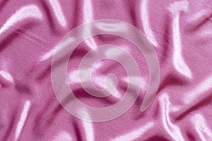 Abstract pink satin background, beautiful fabric texture