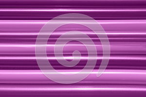Abstract pink striped background, horizontal view. Purple backdrop.