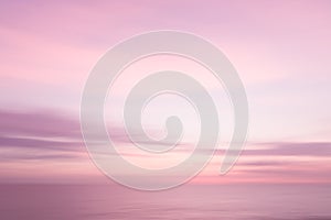 Abstract pink sunset sky and ocean nature background.