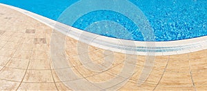 Abstract Pool with blue water background. Top view of swimming pool and floor texture. Panorama of pool bottom with tile