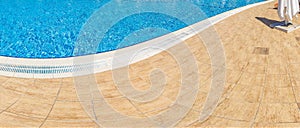 Abstract Pool with blue water background. Top view of swimming pool and floor texture. Panorama of pool bottom with tile