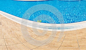 Abstract Pool with blue water background. Top view of swimming pool and floor texture. Panorama of pool bottom with tile pattern