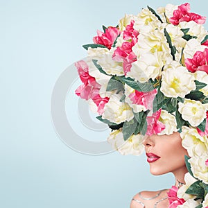 Abstract portrait of young beautiful woman with flowers hairdo