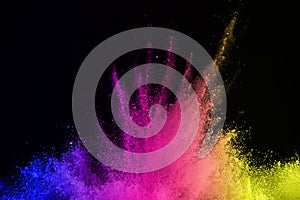 Abstract powder splatted background. Colorful powder explosion on black background. Colored cloud. Colorful dust explode. Paint Ho