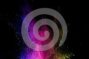 Abstract powder splatted background. Colorful powder explosion on black background. Colored cloud. Colorful dust explode. Paint Ho