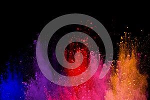 abstract powder splatted background. Colorful powder explosion on black background. Colored cloud. Colorful dust explode. Paint Ho