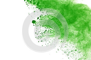 Abstract powder splatted background,Freeze motion of green powder exploding/throwing green dust