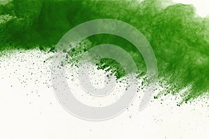 Abstract powder splatted background,Freeze motion of green powder exploding/throwing green dust.