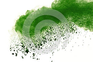 Abstract powder splatted background,Freeze motion of green powder exploding/throwing green dust