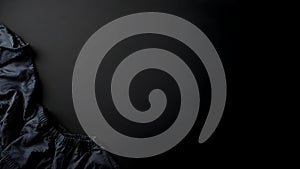 Abstract presentation of different types of clothes on dark background