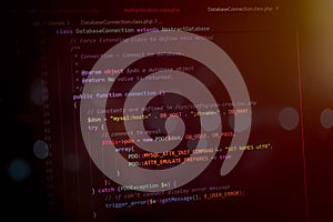Abstract programming code on computer screen showing database connection and backend development concept. Software engineering,
