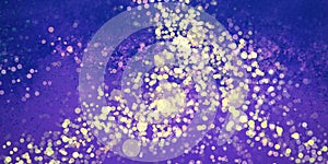 Abstract purple blue and yellow gold background design with paint spatter and bokeh lights texture