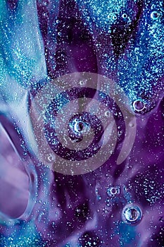 Abstract purple liquid background, paint splash, swirl pattern and water drops, beauty gel and cosmetic texture