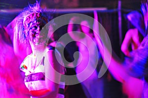 Abstract purple people dancing nightclub photo