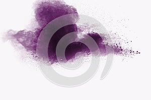 Abstract purple powder explosion on white background, Freeze motion of purple dust splashing
