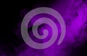 Abstract Purple smoke on black background.