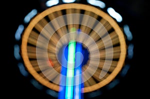 Abstract random colourful defocused blurred night life of fun fair background pattern