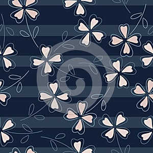Abstract random four-leaf clover shapes seamless pattern. Navy blue striped background. Abstract print