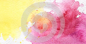 Abstract real watercolor background. Big yellow spot is iridescently flowing into a red spot. Lots of small spatter. Chaotic