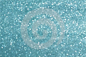 Sparkly glitter, turquoise background bokeh effect