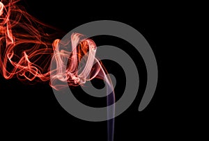 Abstract red blue smoke from aromatic sticks.