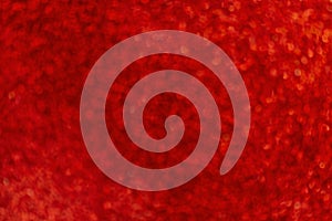Abstract red bokeh background. Blurred bright light. Circular points. Colorful. Defocused background