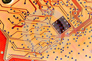 Abstract red computer circuit board close up