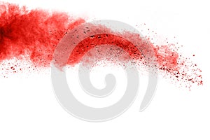 Abstract red dust explosion on white background.