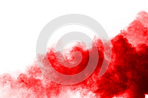 Abstract red dust explosion on white background.