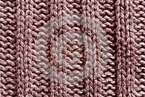 Abstract red knitting texture close-up.