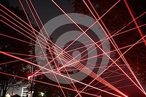 Abstract red lines drawn by light on a black background