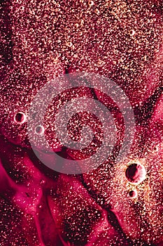 Abstract red liquid background, paint splash, swirl pattern and water drops, beauty gel and cosmetic texture