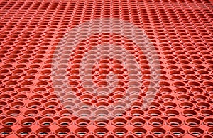 Abstract red perforated plastic background